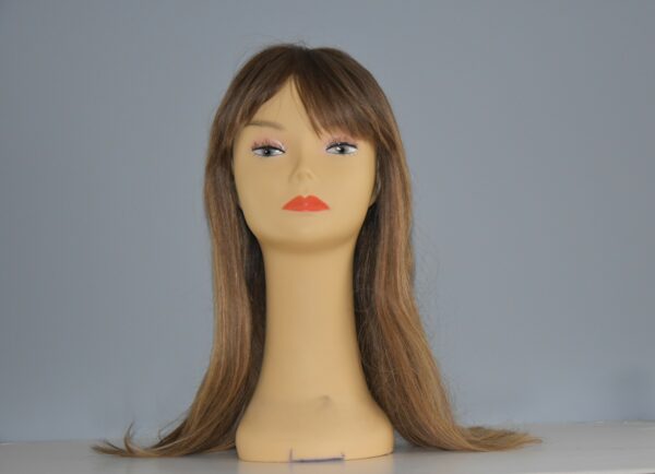 long brown human hair wig on mannequin head