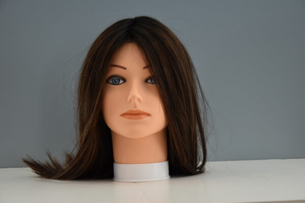 long brown synthetic wig on mannequin head
