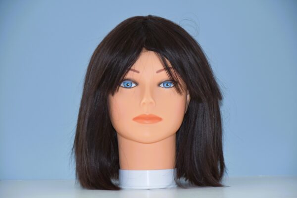 medium length black synthetic wig on mannequin head