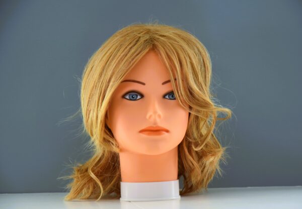 medium length blonde synthetic wig on mannequin head