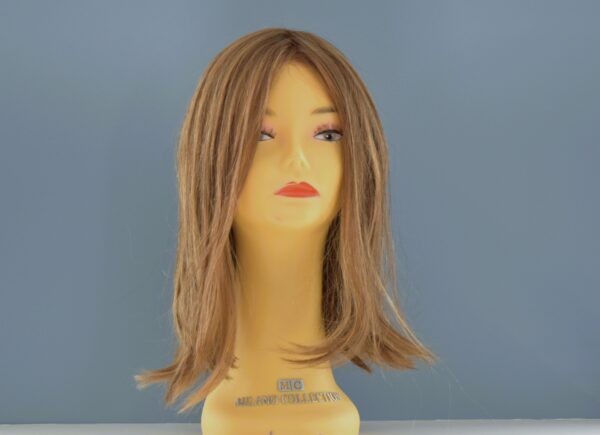 medium length blonde synthetic wig on mannequin head