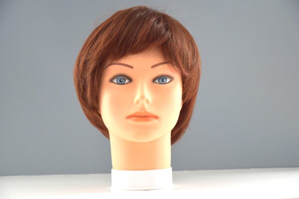short red synthetic wig on mannequin head