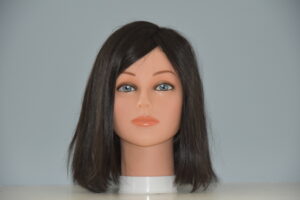 short black synthetic wig on mannequin head