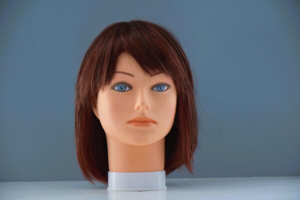 short red synthetic wig on mannequin head