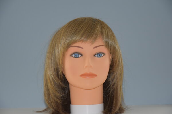 medium length blondish brown wig on mannequin head