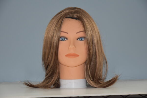 Medium length brown synthetic wig on mannequin head