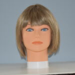 short blonde synthetic wig on mannequin head