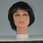 short black synthetic wig on mannequin head