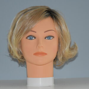 short blonde synthetic wig on manneqin head