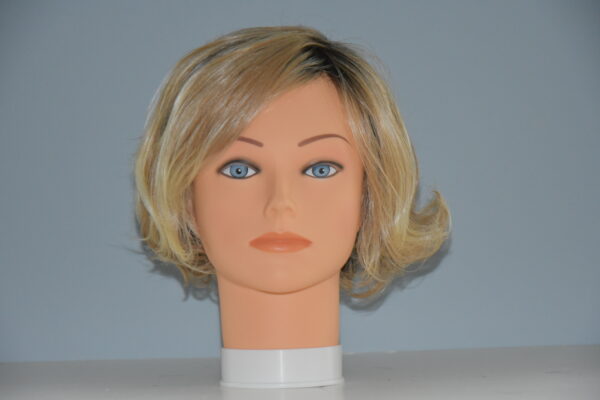 short blonde synthetic wig on manneqin head