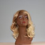 long blonde synthetic wig on mannequin head