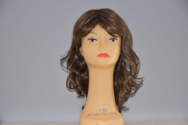 long brown synthetic wig on mannequin head