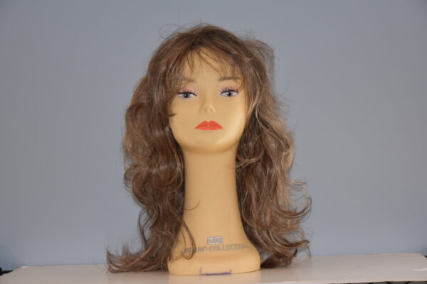 long brown synthetic wig on mannequin head