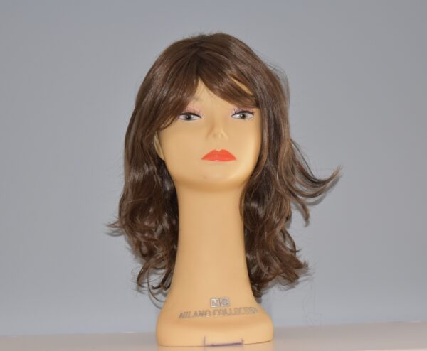 long brown synthetic ig on mannequin head