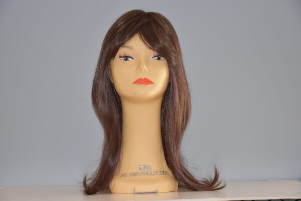 long brown synthetic wig on mannequin head