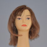 medium length brown human hair wig on mannequin head