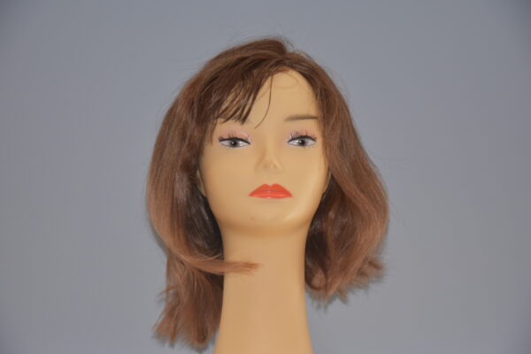 medium length brown human hair wig on mannequin head
