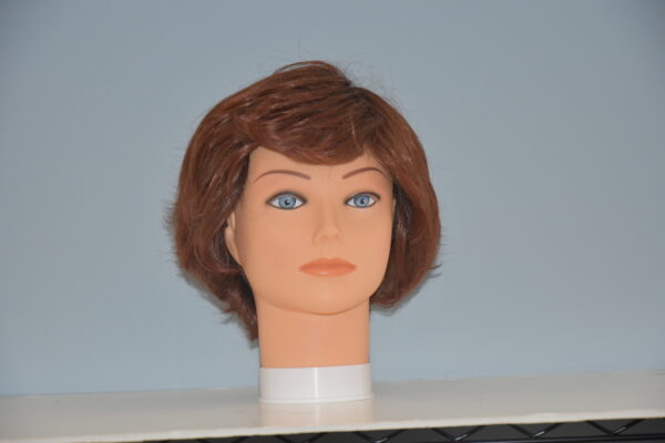 short red synthetic wig on mannequin head