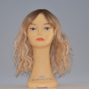 medium length blonde synthetic wig on mannequin head