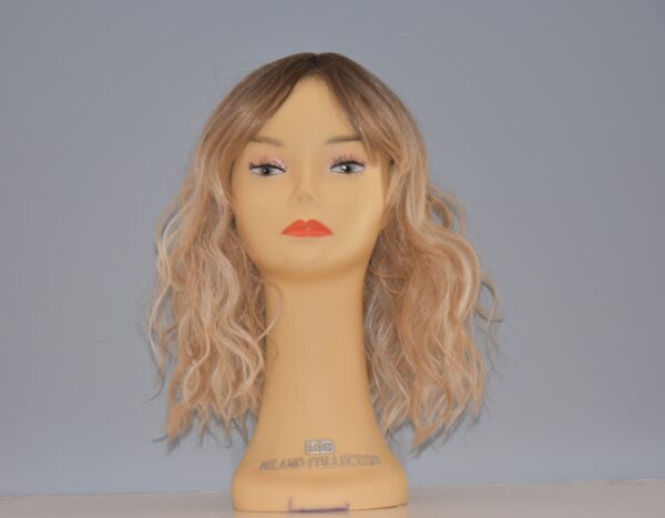 medium length blonde synthetic wig on mannequin head