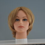 short blonde synthetic wig on mannequin head