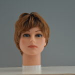short red synthetic wig on mannequin head