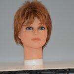 short red synthetic wig on mannequin head