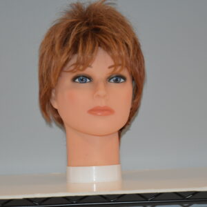 short red synthetic wig on mannequin head
