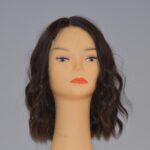 medium length black synthetic wig on mannequin head