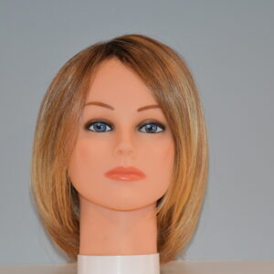 short blonde synthetic wig on mannequin head