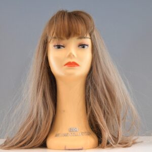 long blonde synthetic wig on mannequin head