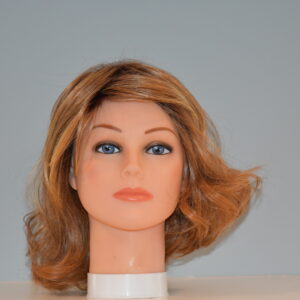 medium length red synthetic wig on mannequin head