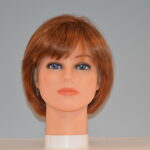 short red synthetic wig on mannequin head
