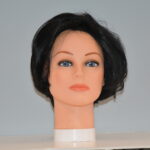 short black synthetic wig on mannequin head