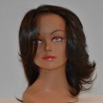 medium length black synthetic wig on mannequin head