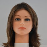 medium length brown synthetic wig on mannequin head